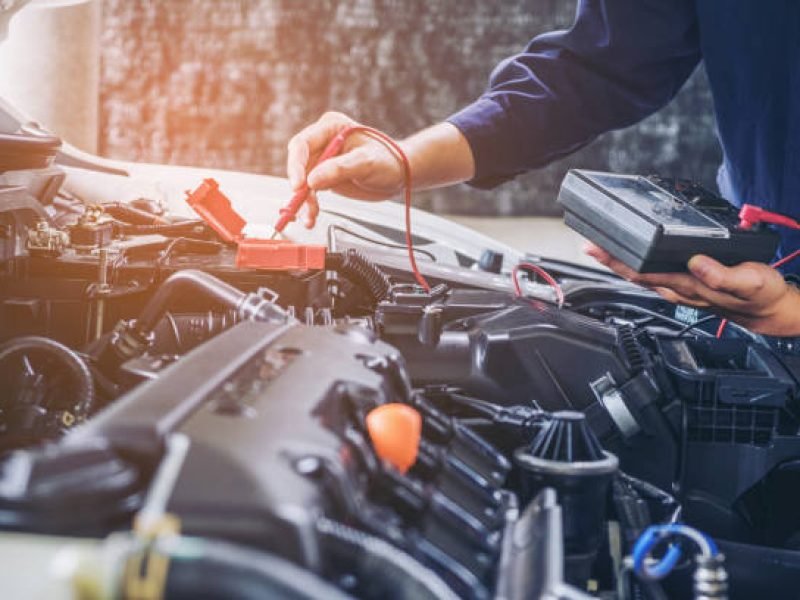 Hands of car mechanic  working in auto repair service.